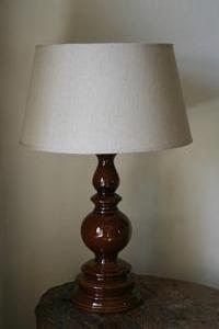A brown base ceramic table lamp.