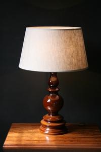 A brown base ceramic table lamp.