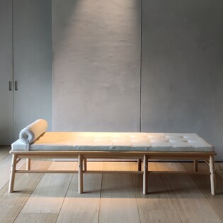 A pine and white leather daybed by Nike Karlsson for Ikea