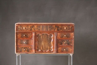 Wooden cabinet on metal pedestal