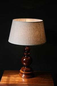 A brown base ceramic table lamp.