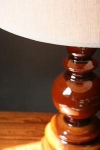 A brown base ceramic table lamp.