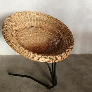 A rotan and black metal vintage lounge chair