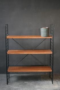 A Tomado black metal and wooden etagère