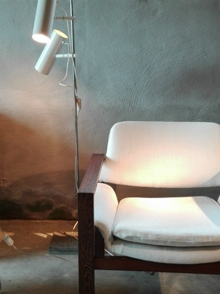A white linnen and wooden armchair by yngveekstrôm for Pastoe