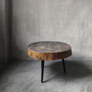 Brutalist treetrunk side table on black wooden feet